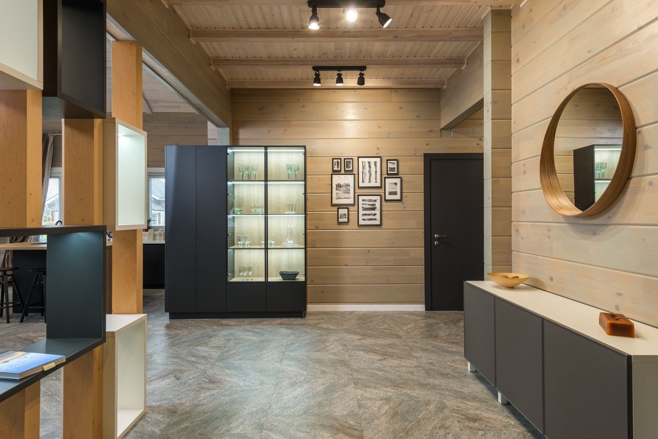 Services Spacious and elegant modern apartment interior with minimalist design featuring wooden accents and luxury decor.