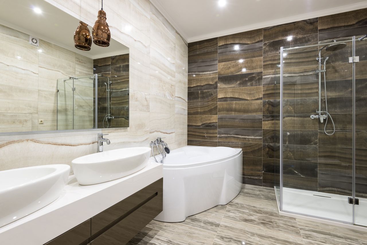 Contemporary bathroom design featuring sleek white fixtures and stylish tiles.